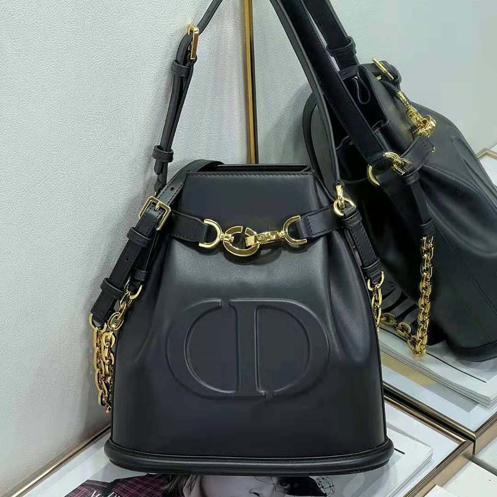 Close-up of silver-tone CD hardware on Dior Women Medium C’est Dior Bag