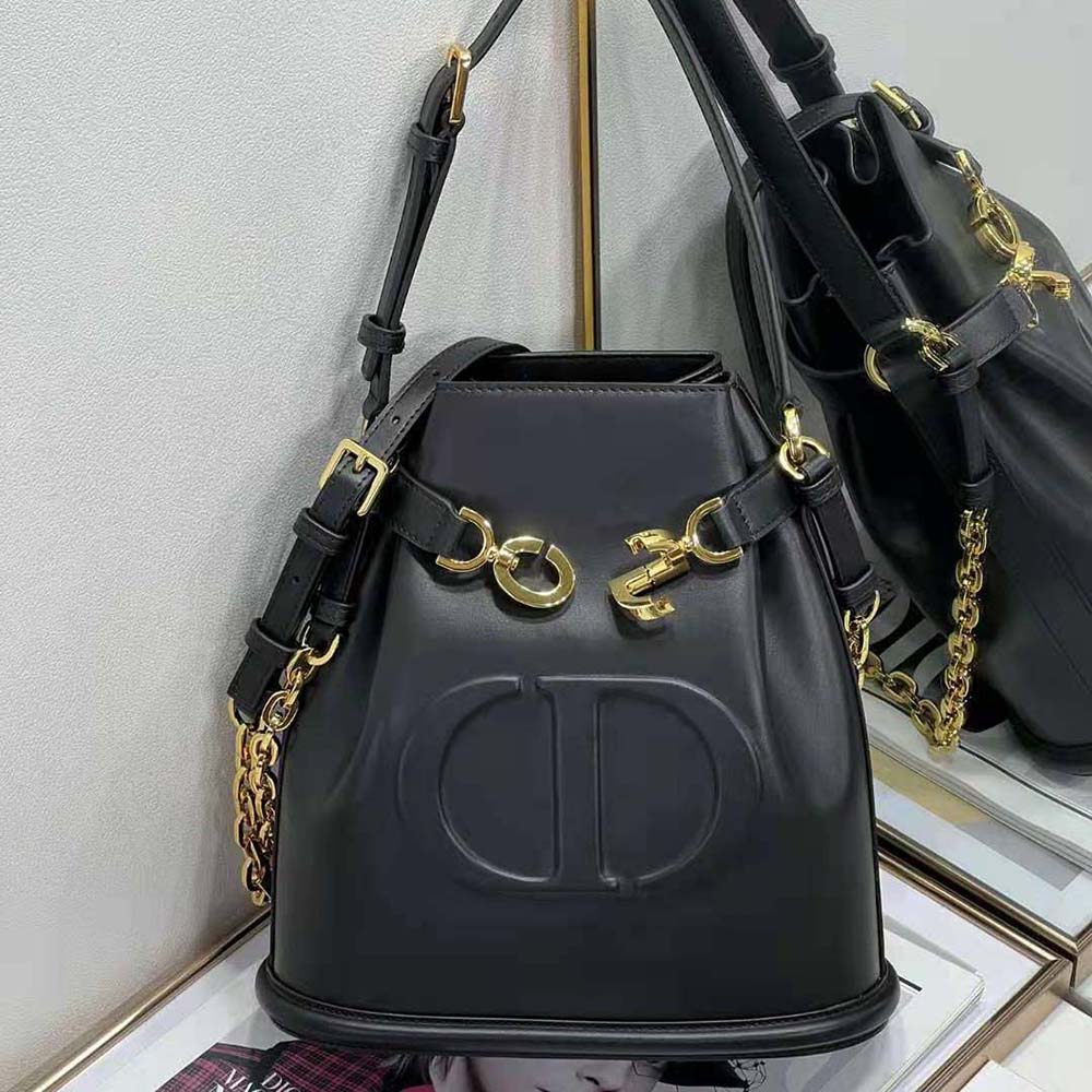 Side angle showing supple black calfskin texture on Dior Women Medium C’est Dior Bag