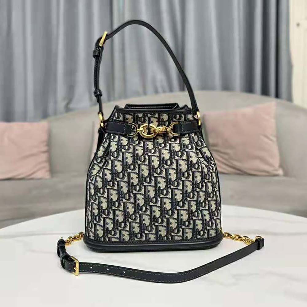 Side profile showing structured silhouette of Dior Women Medium C’est Dior Bag in blue