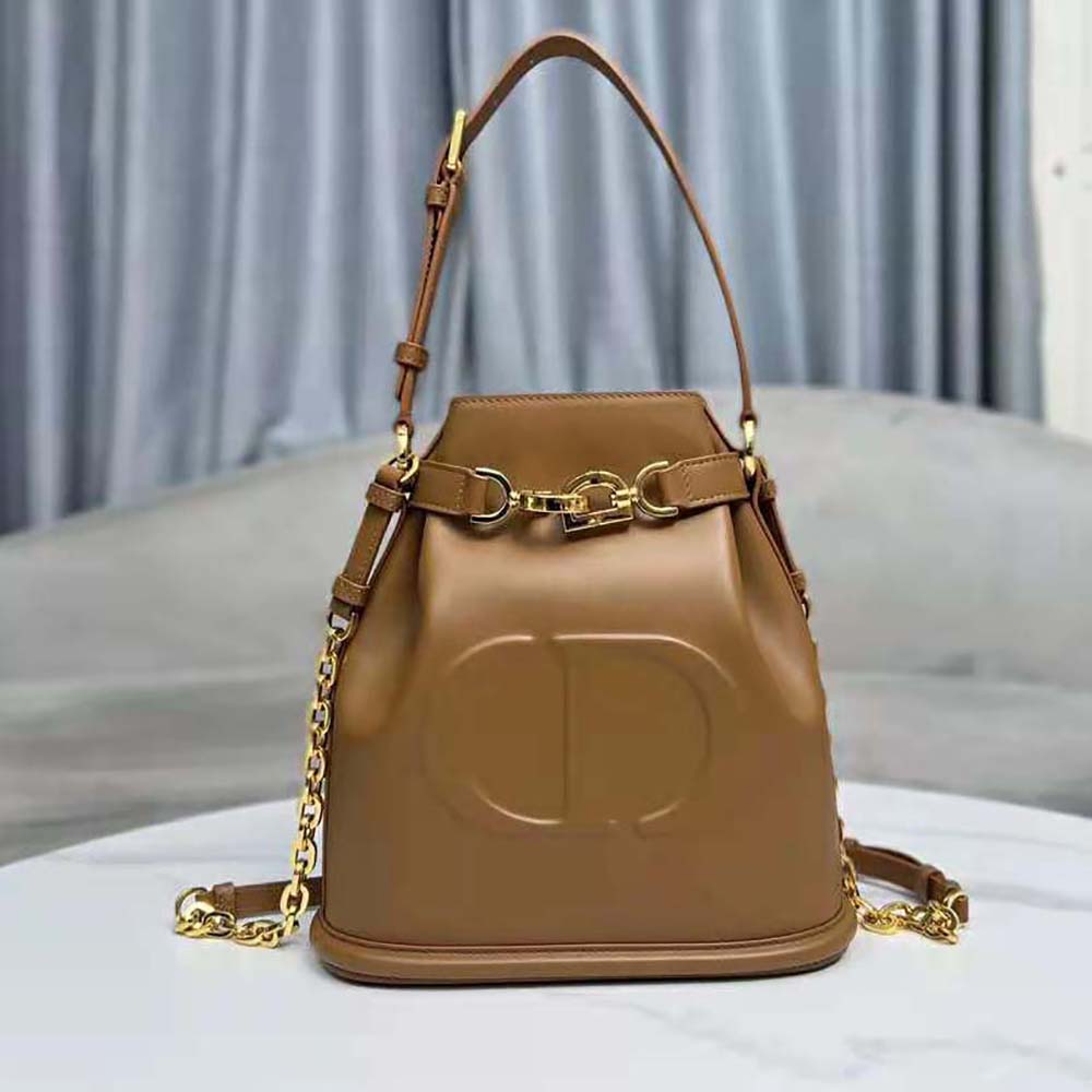 Side angle showing silhouette of Dior Women Medium C’est Dior Bag brown calfskin