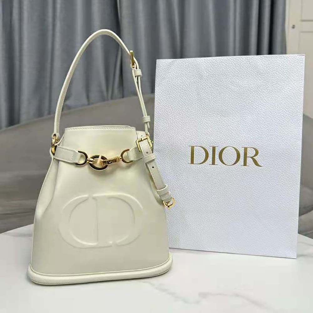 Close-up of silver-tone CD hardware on Dior Women Medium C’est Dior Bag