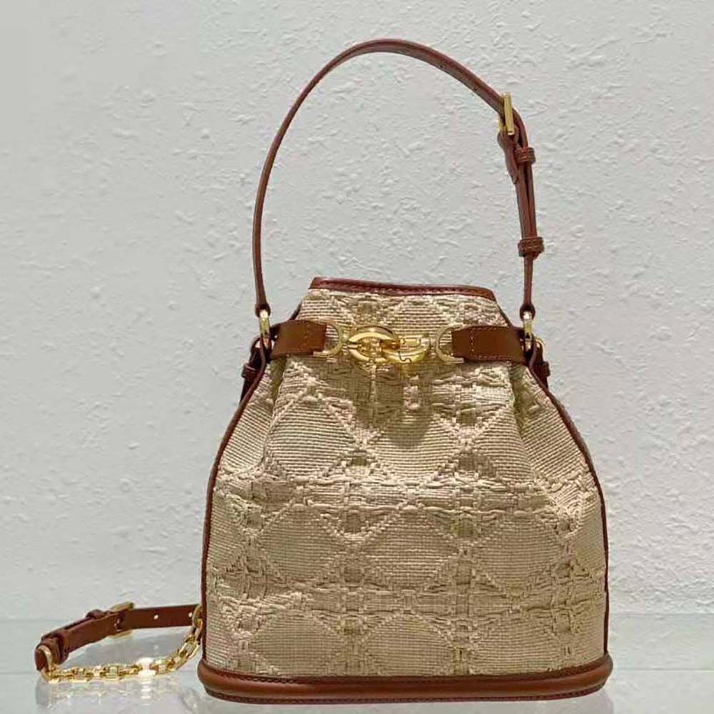 Close-up of gold Cannage hardware on Dior Women Medium C’est Dior Bag