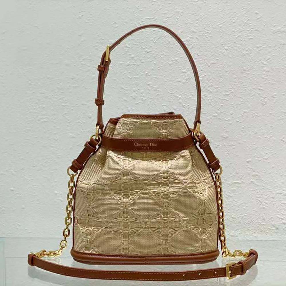 Side angle showing woven raffia texture on Dior Women Medium C’est Dior Bag