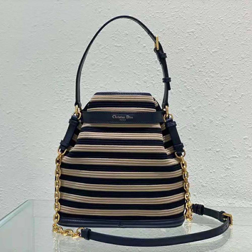 Side angle showing medium shoulder strap of Dior Women Medium C’est Dior Bag