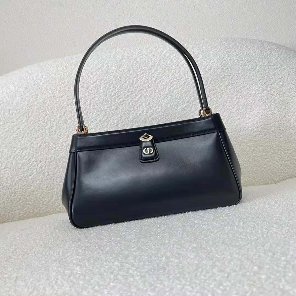 Side angle highlighting structured silhouette of Dior Women Medium Key Bag