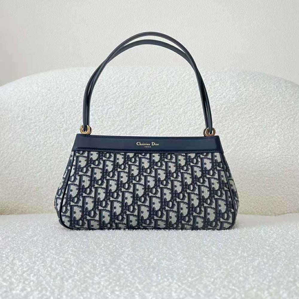 Side angle showing flap closure on Dior Women Medium Dior Key Bag Blue Dior Oblique Jacquard
