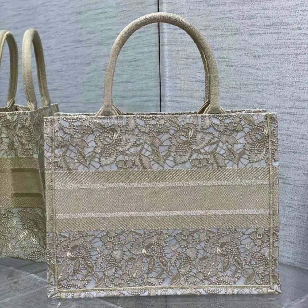 Side angle showing spacious silhouette and gold hardware on Dior tote