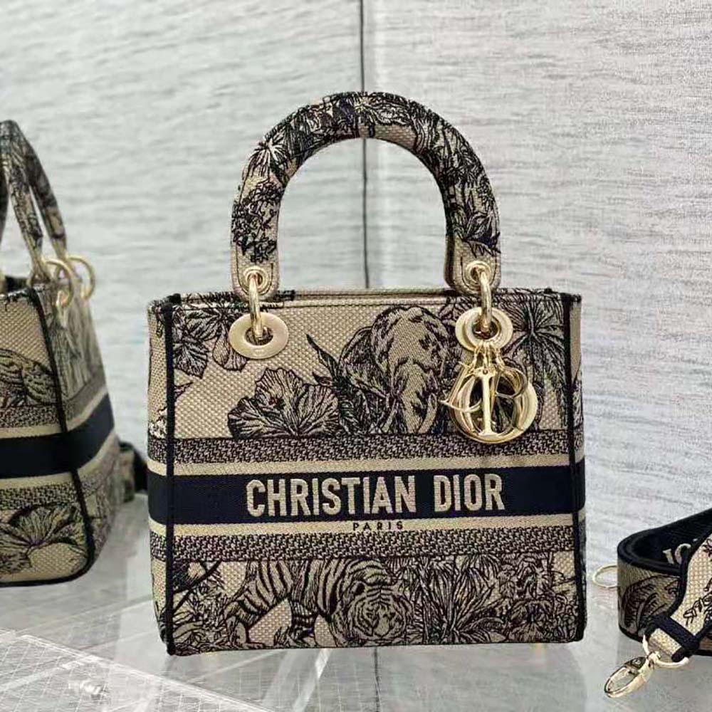 Side angle showing silver hardware and flap closure on Dior Women Medium Lady D-lite Bag