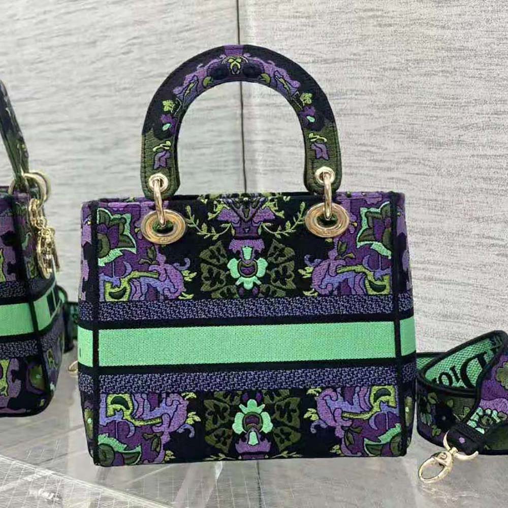 Side profile showing structured silhouette of Dior Women Medium Lady D-lite Bag