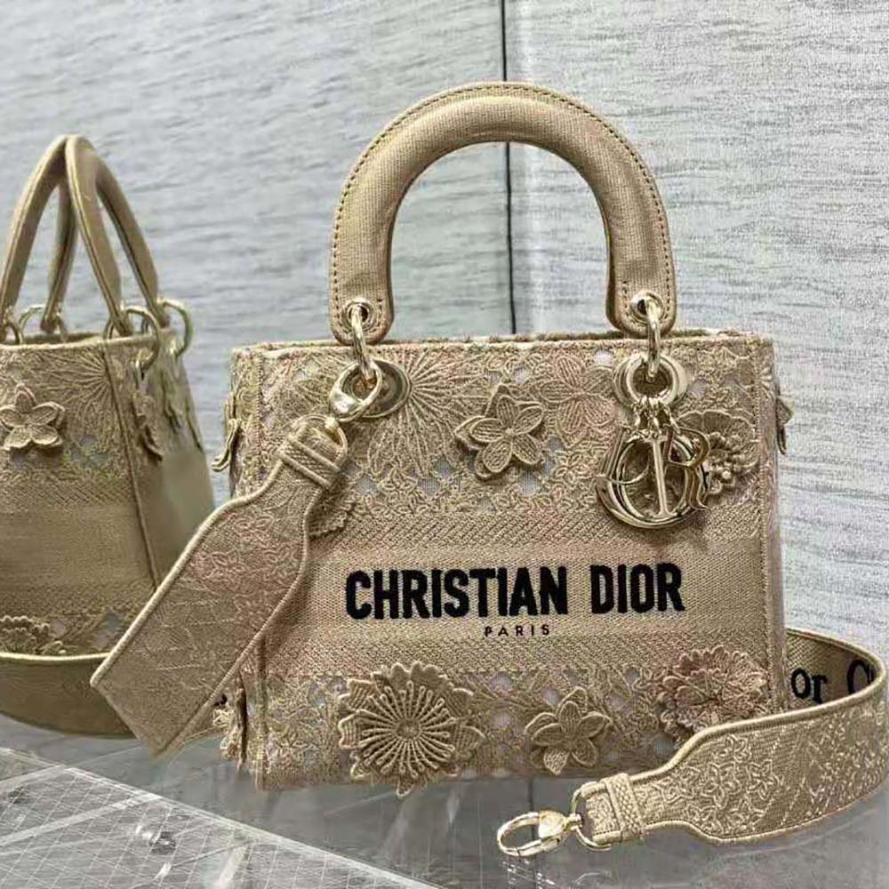Close-up of natural lace embroidery and silver hardware on Dior Women Medium Lady D-lite Bag