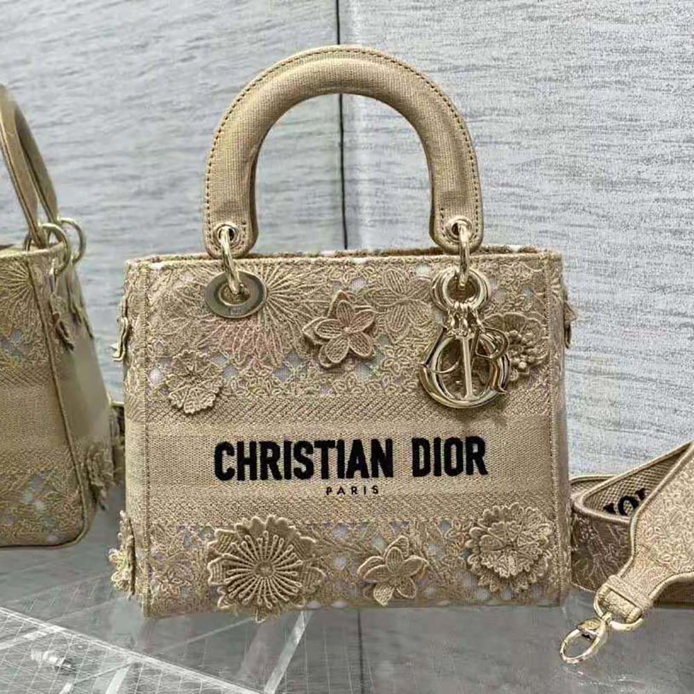 Side angle showing structured silhouette and adjustable strap of Dior Women Medium Lady D-lite Bag