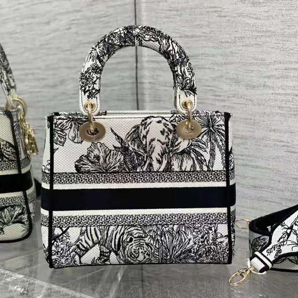 Side profile showing structured silhouette of Dior Women Medium Lady D-lite Bag