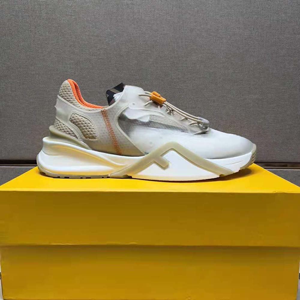 Close-up of beige nylon and Fendi logo hardware on low-tops