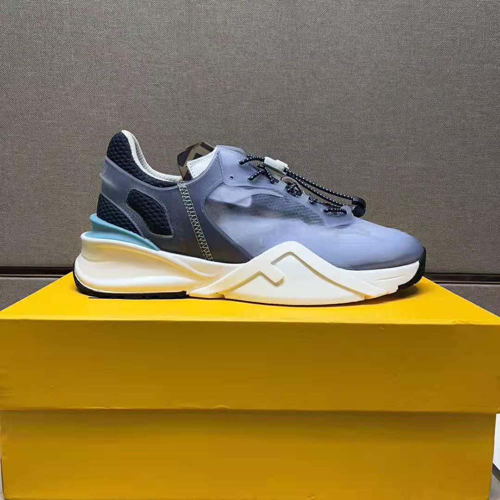 Close-up of lace-up closure and Fendi logo hardware on blue low-tops