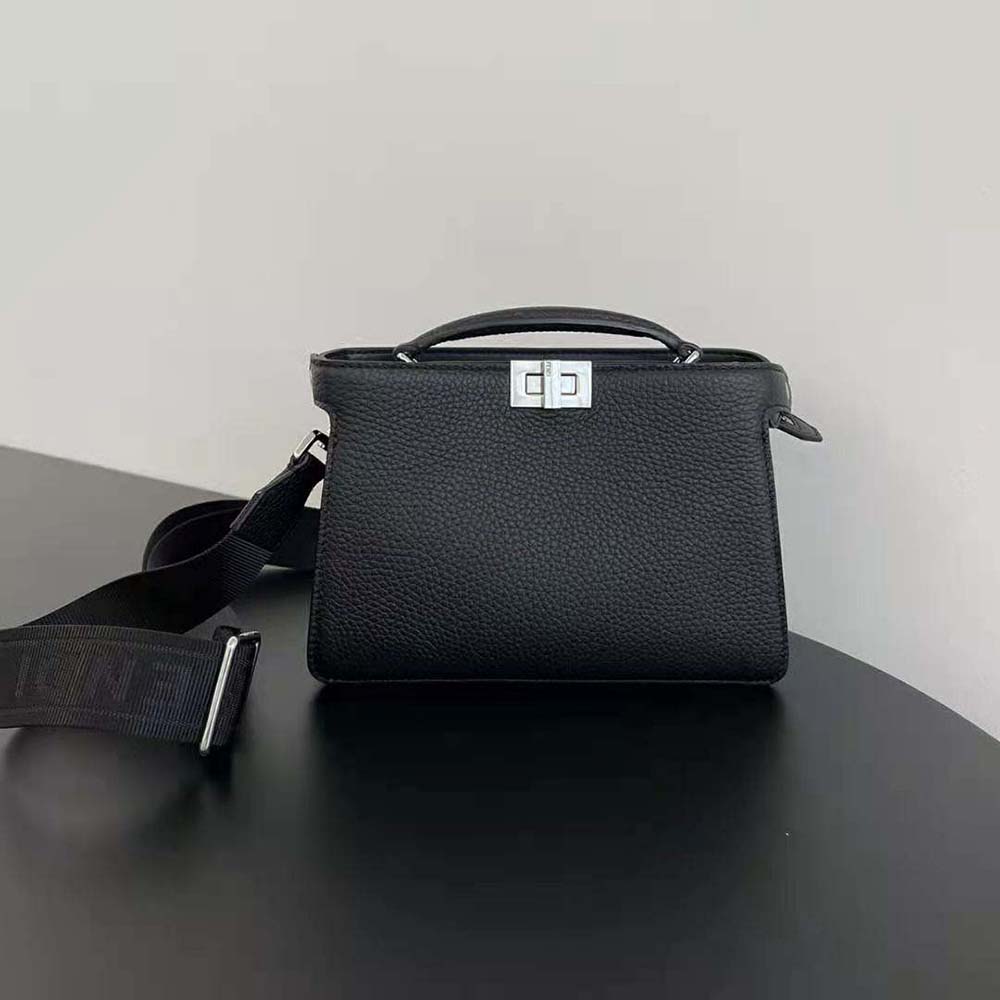 Close-up of gold hardware on Fendi Men Peekaboo ISeeU XCross Black Leather Bag
