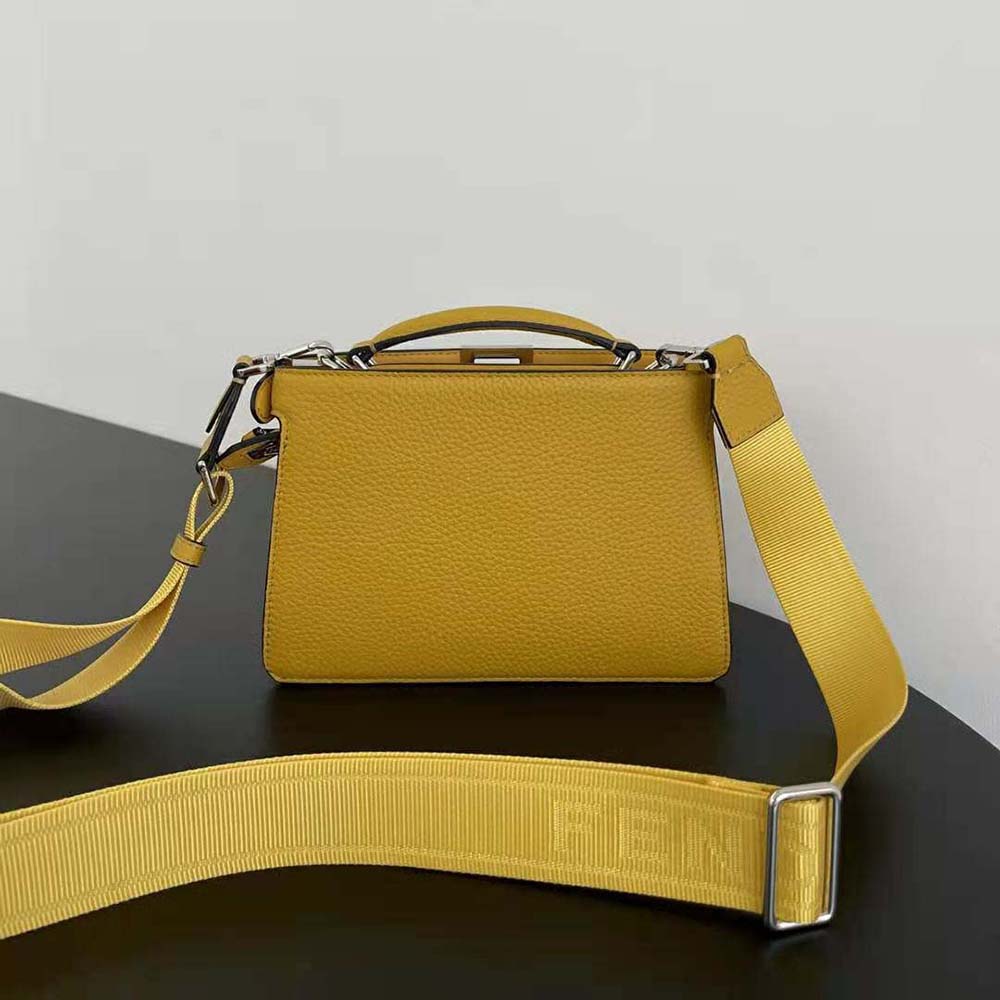 Side view showing adjustable strap of Fendi Men Peekaboo ISeeU XCross Orange Leather Bag