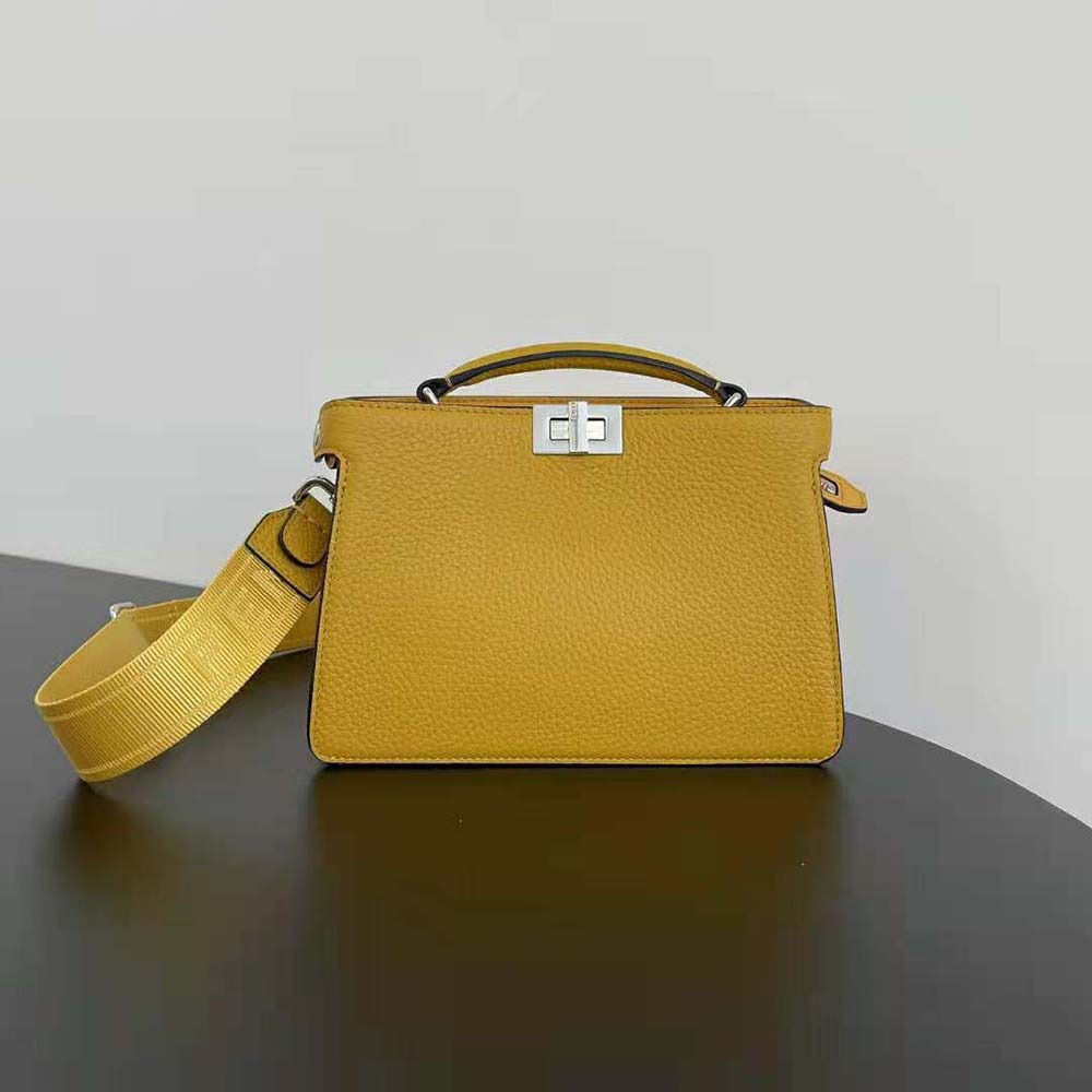 Close-up of gold hardware on Fendi Men Peekaboo ISeeU XCross Orange Leather Bag