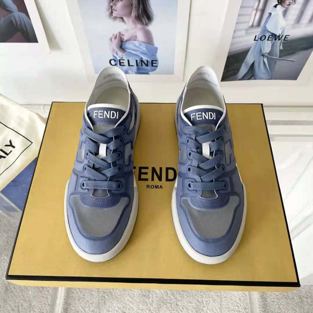 Close-up of gold-tone Fendi logo hardware on Match Blue Mesh Low Tops