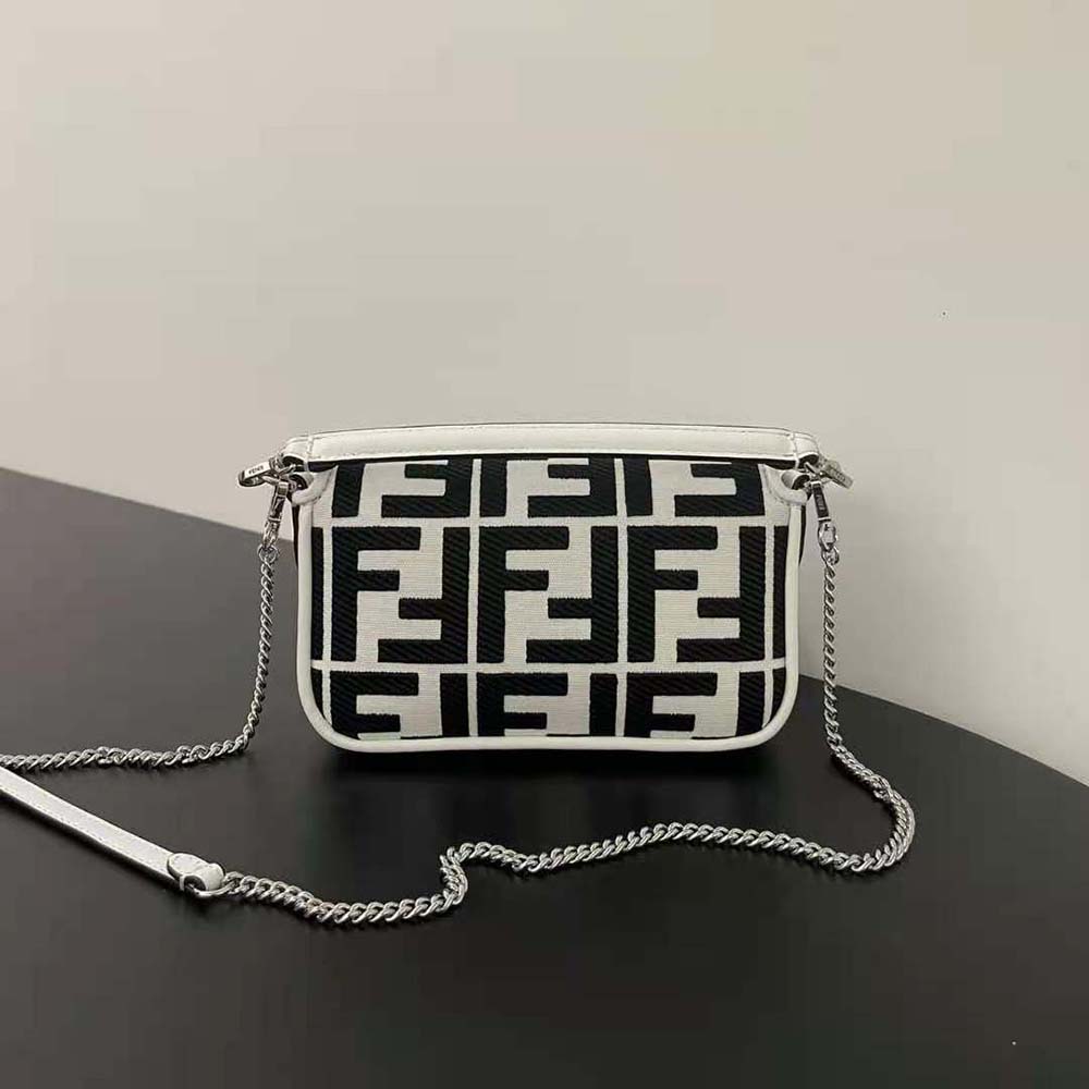 Side angle showing slim silhouette of Fendi Women Baguette Mini Canvas Bag
