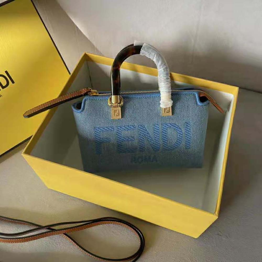 Close-up of silver-tone Fendi hardware on denim bag