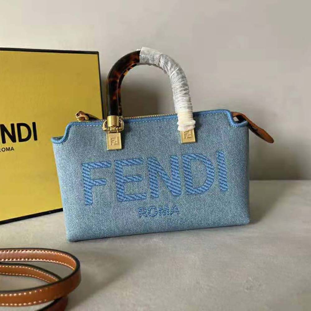 Side view showing adjustable strap of Fendi denim Boston bag