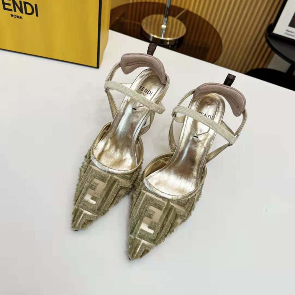 Close-up of gold mesh and Fendi logo buckle detail on slingback