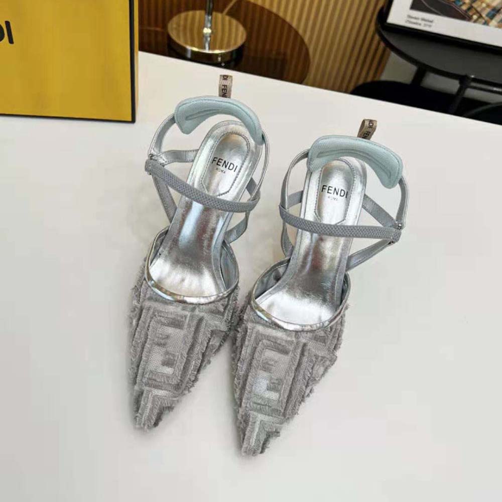 Close-up on silver mesh and silver-tone hardware of Fendi slingbacks