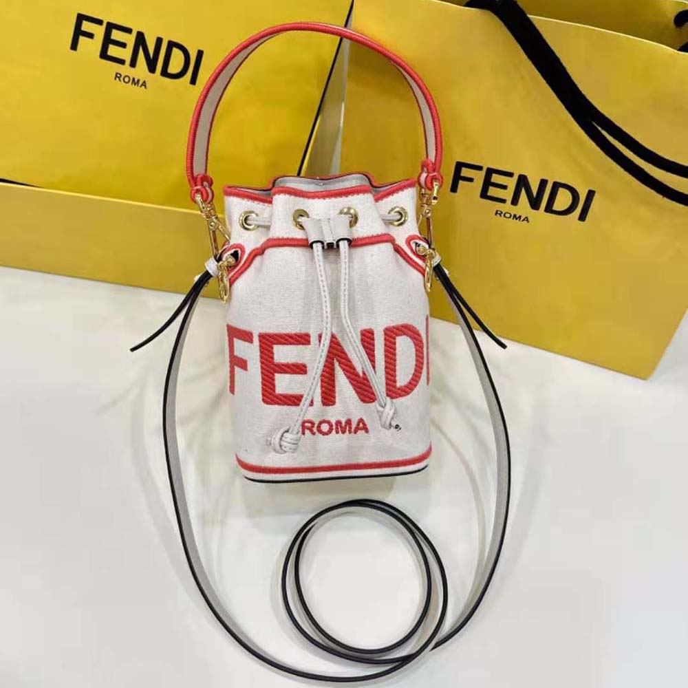Close-up of pink canvas and gold-tone hardware on Fendi Women Mon Tresor mini-bag