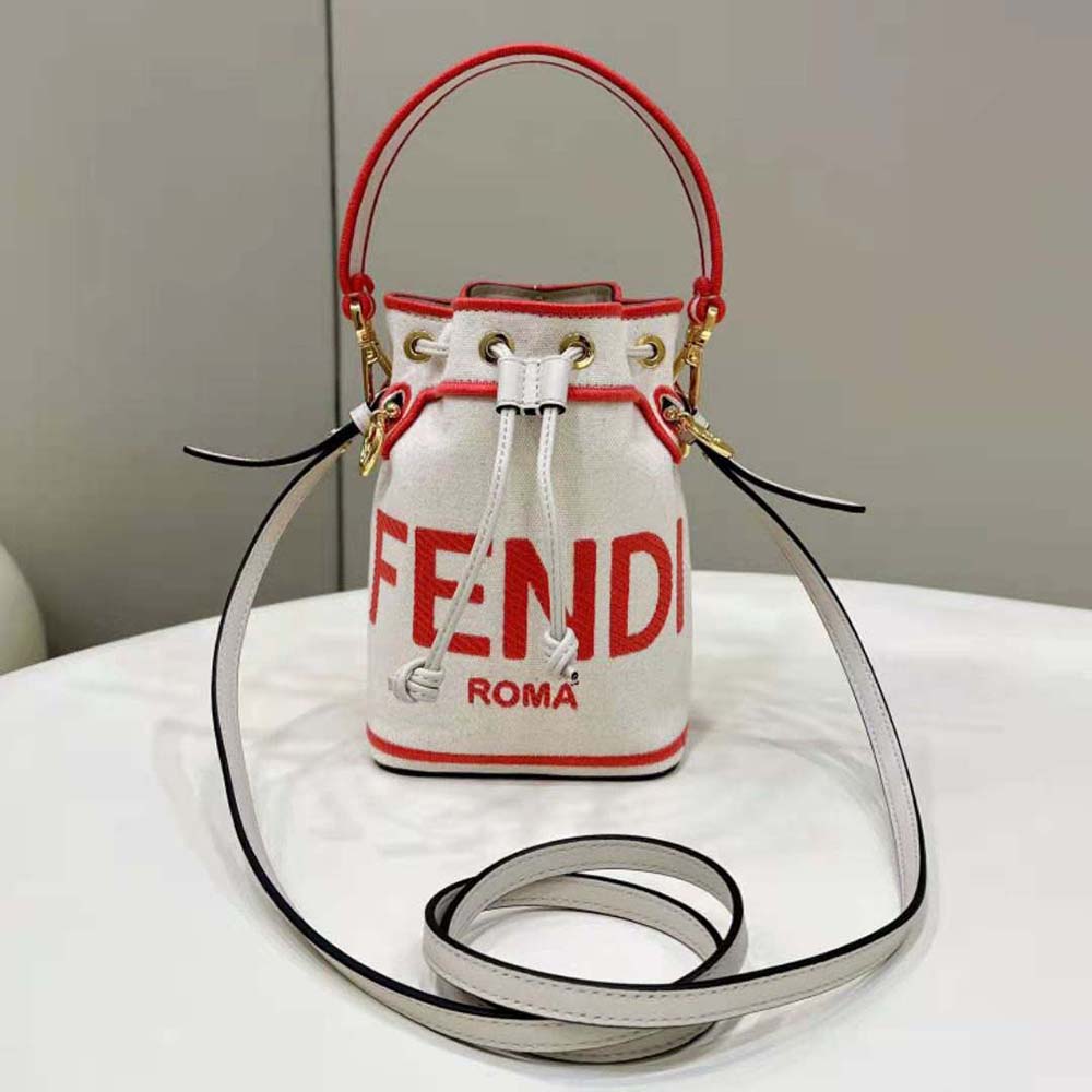 Side angle showing adjustable shoulder strap and flap closure on Fendi Women Mon Tresor bag