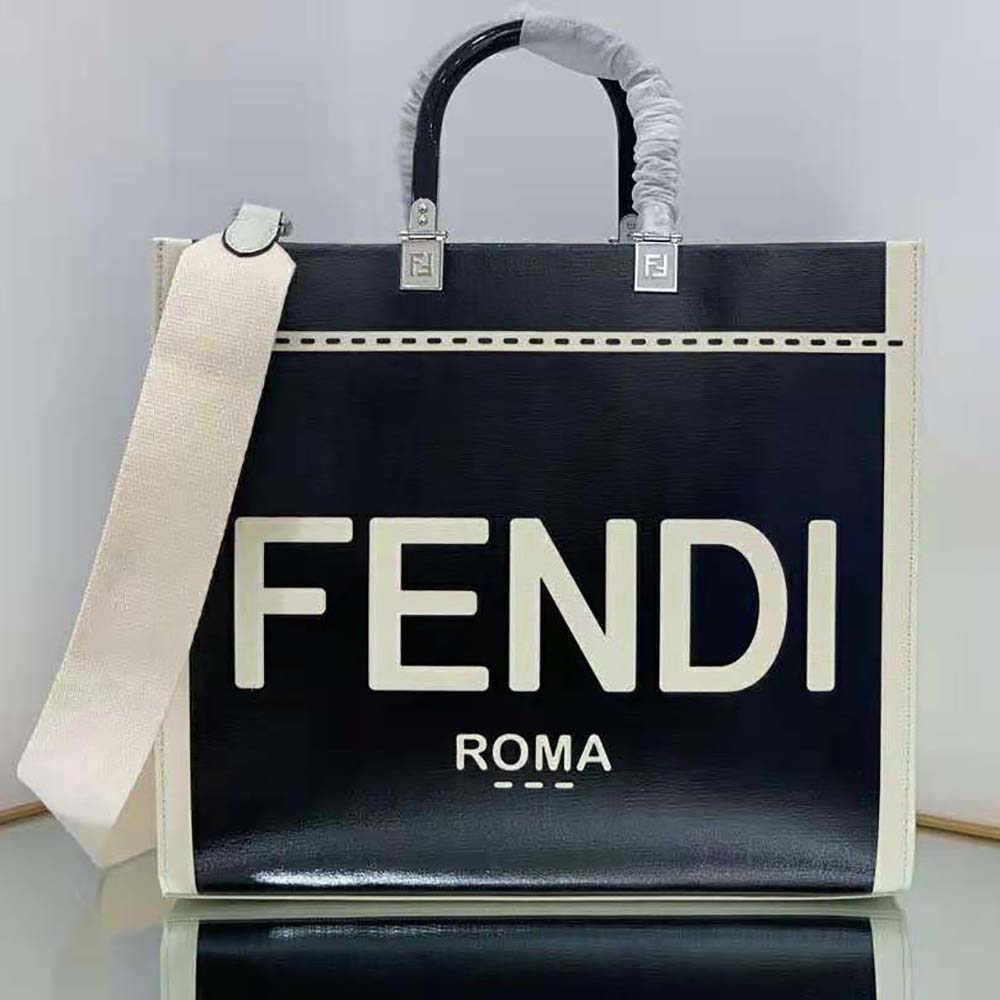 Close-up of gold hardware and black patent leather detail on Fendi shopper bag