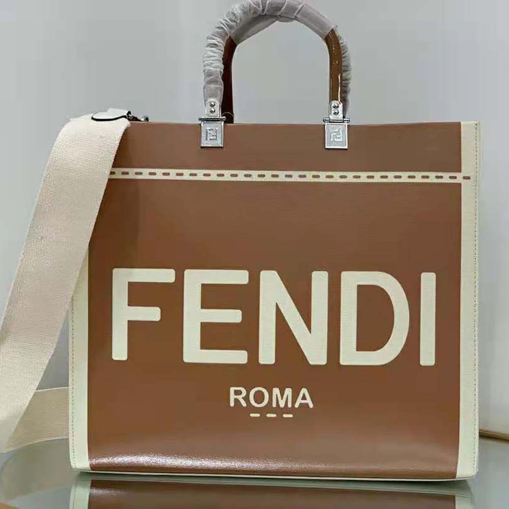 Close-up of brown patent leather and gold-tone hardware on Fendi Women Sunshine shopper