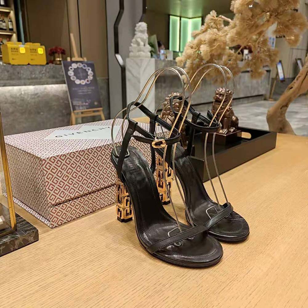 Top angle highlighting buckle and sleek silhouette of Givenchy G Cube Sandals