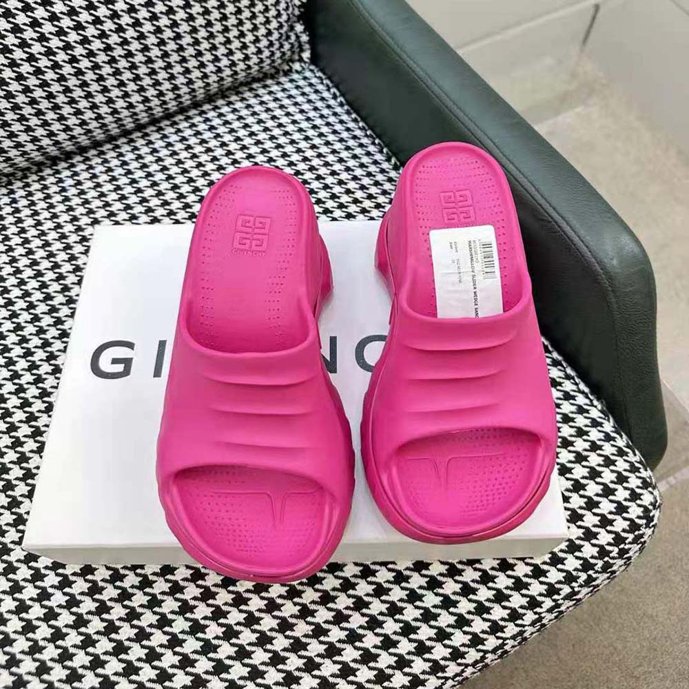 Close-up of embossed Givenchy logo on pink rubber wedge sandal
