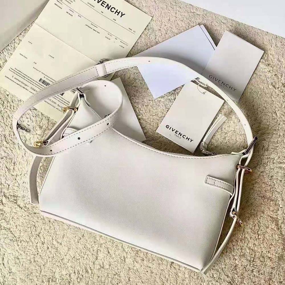 Side angle showing smooth leather and strap of Givenchy Women Mini Voyou Bag in Leather-White
