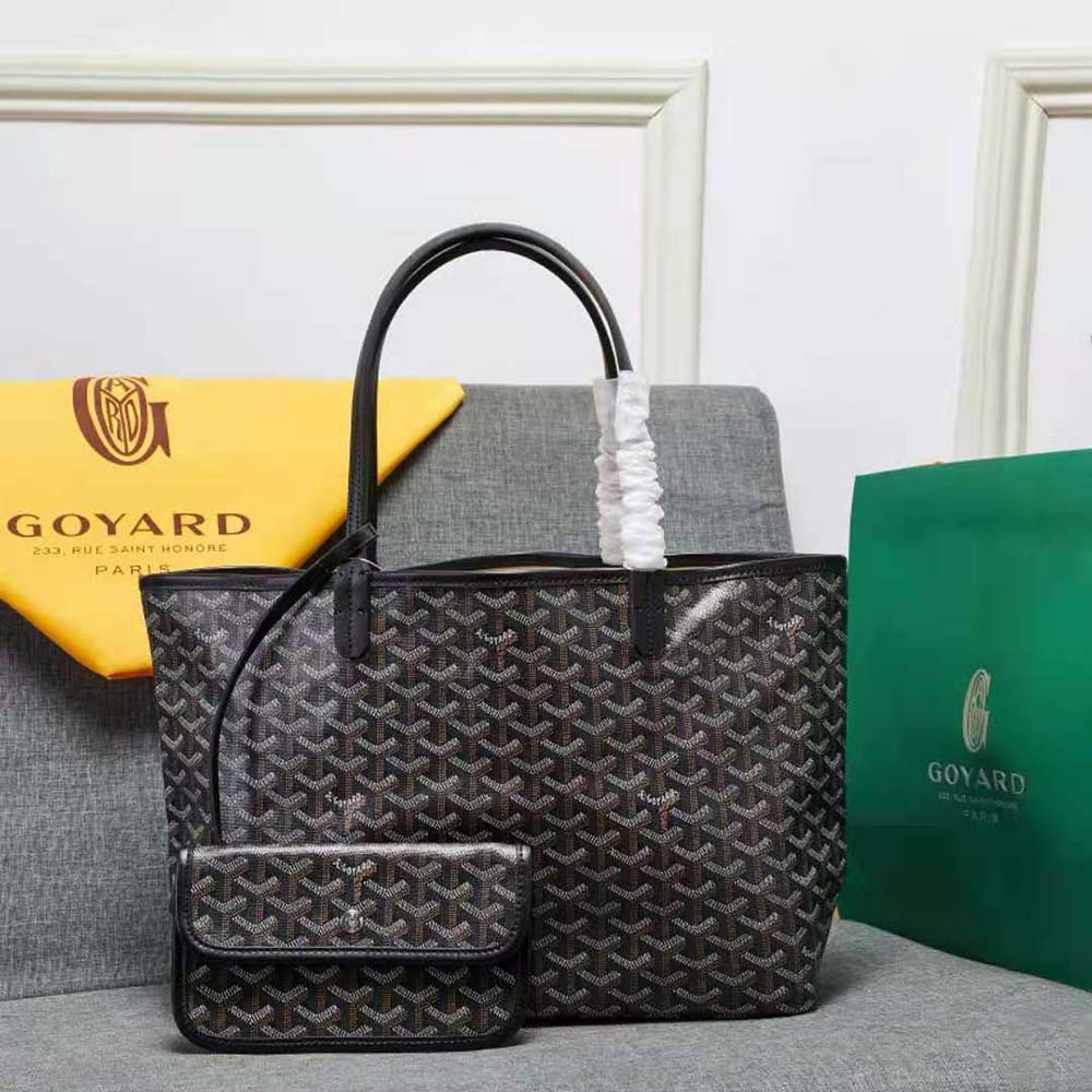 Close-up of black Goyardine canvas and calfskin leather details