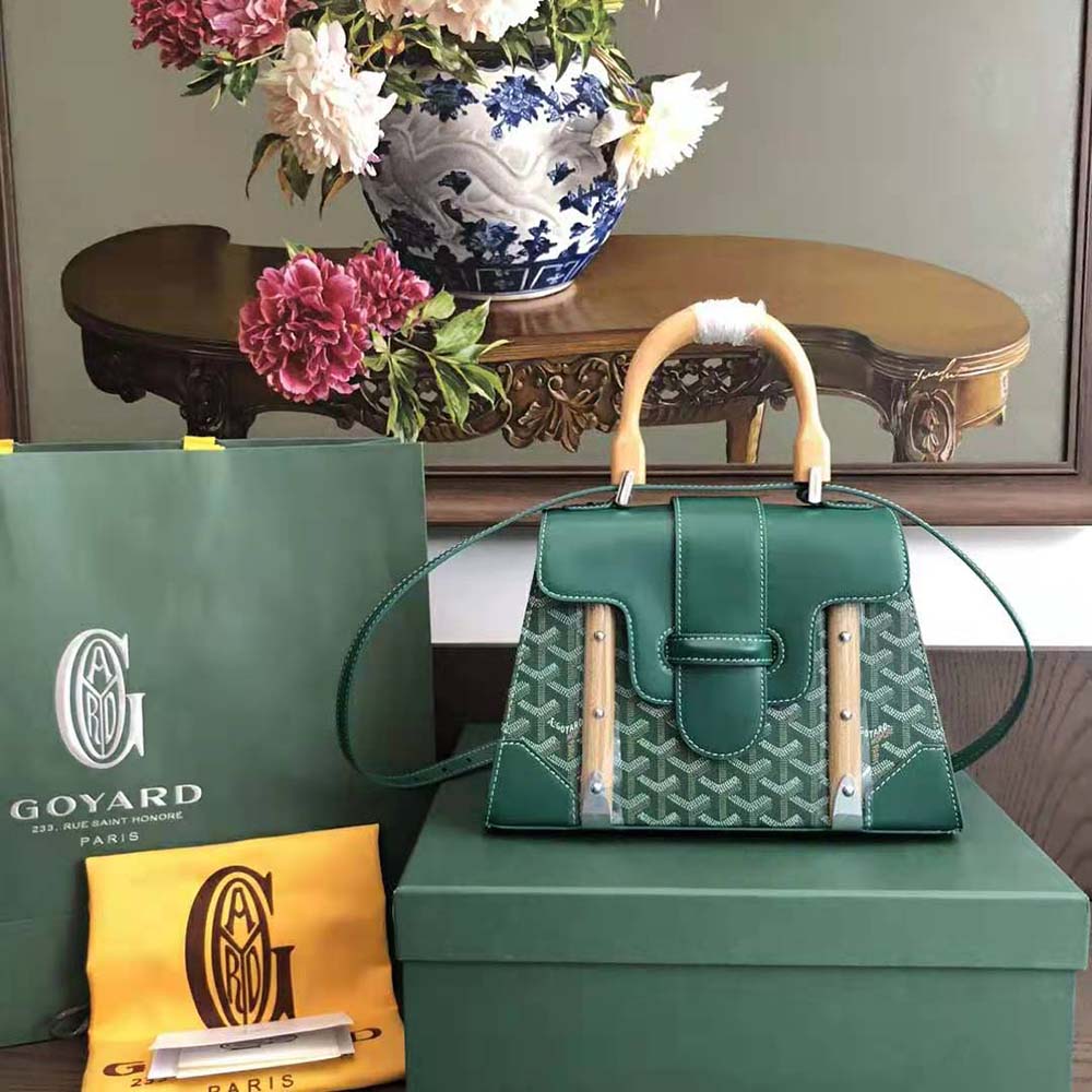 Close-up on polished gold-tone hardware detail of Goyard Women Sac Saïgon PM