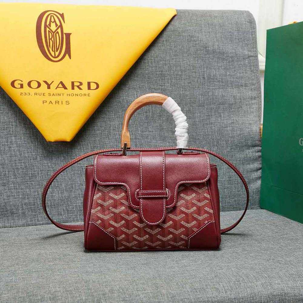 Close-up of chevroches calfskin and brass hardware on Goyard bag