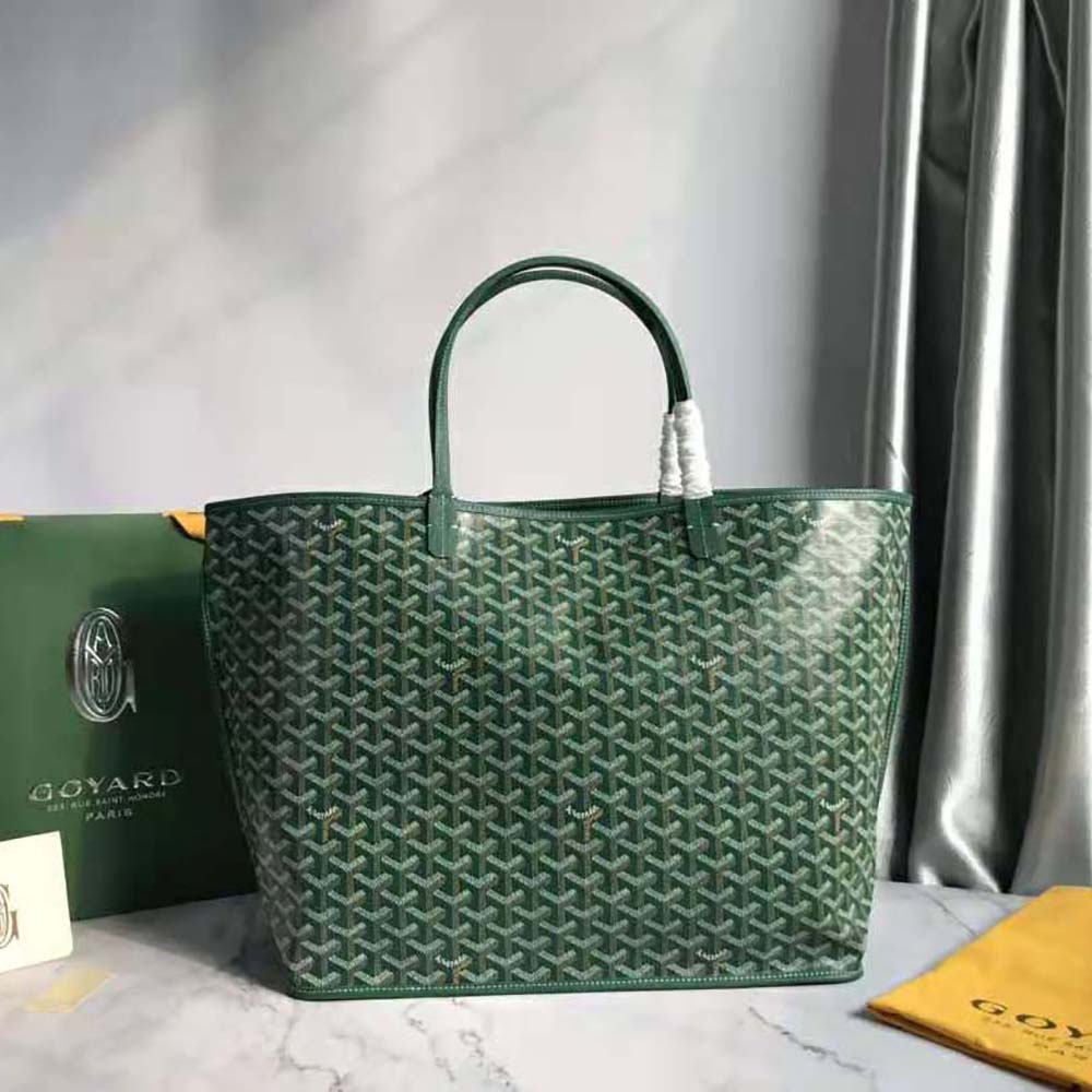 Close-up of green calfskin trim and brass hardware on Goyard Sac Saint Louis GM