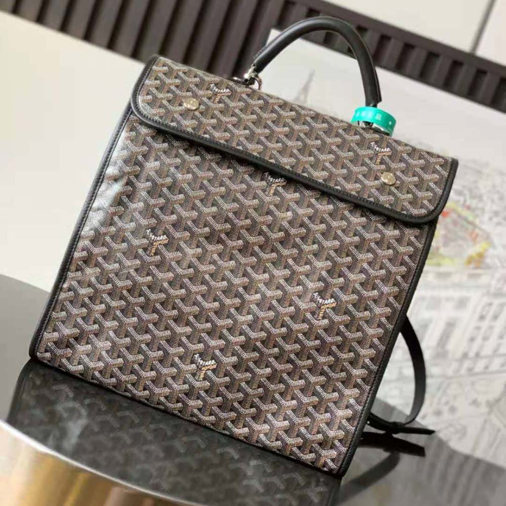 Close-up detail of black calfskin and brass hardware on Goyard Saint Léger Backpack