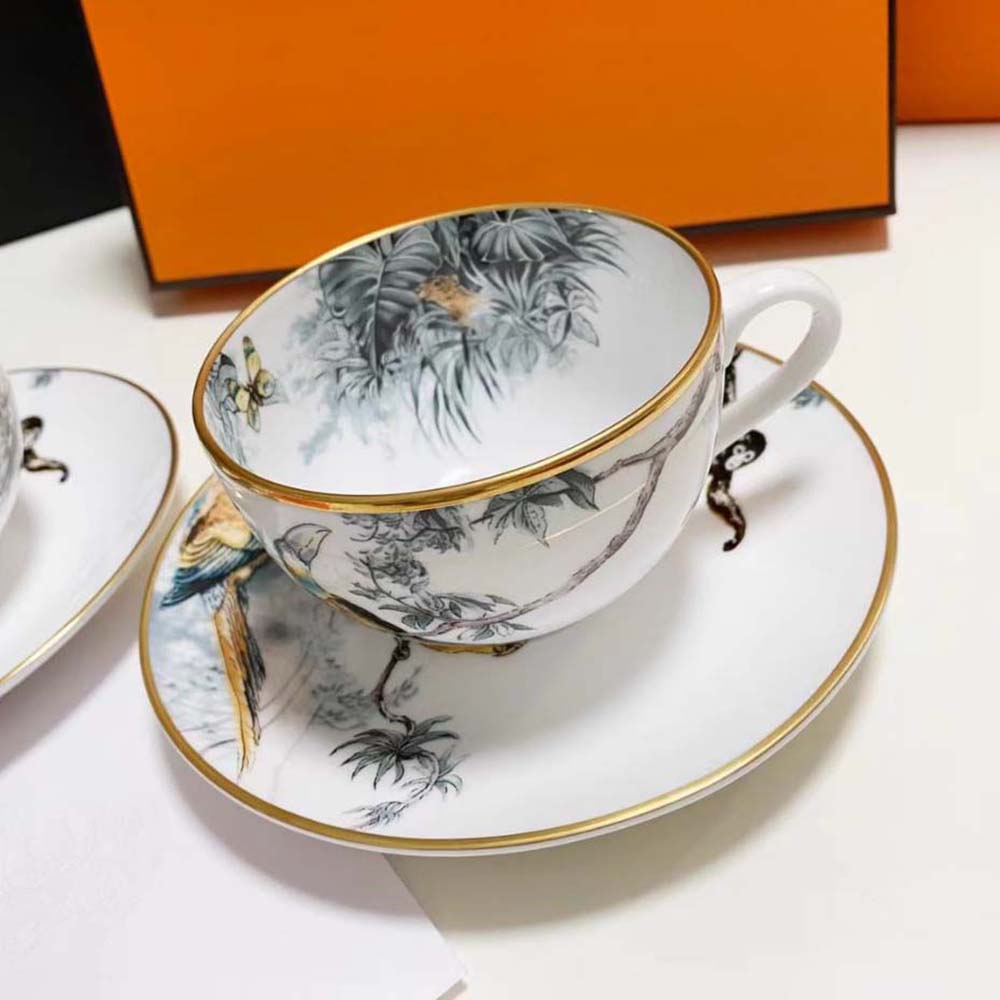 Close-up of hand-painted details on Hermes Carnets D’Equateur tea cup