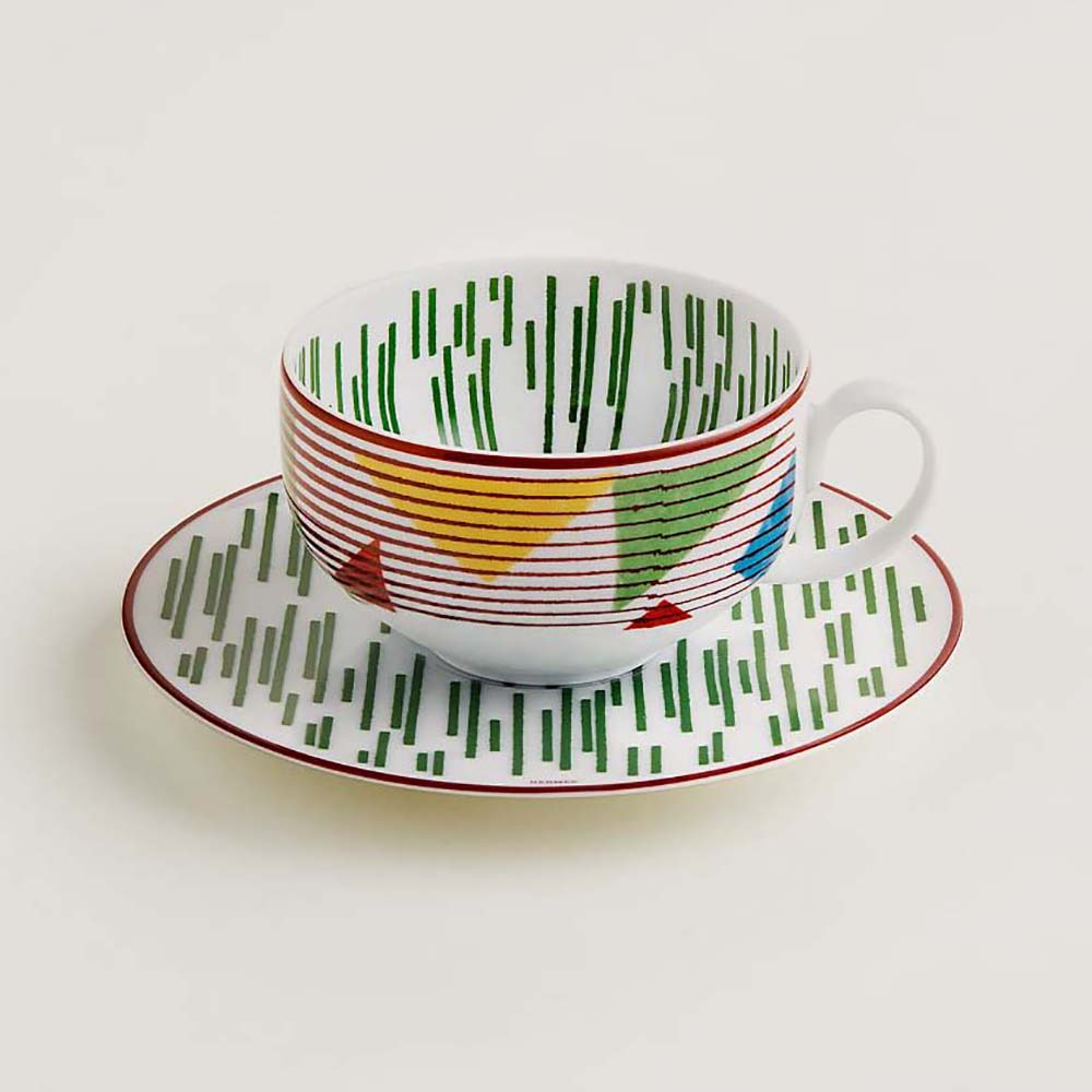 Side view of Hermes Unisex Hermes Hippomobile Tea Cup and Saucer showing green motif