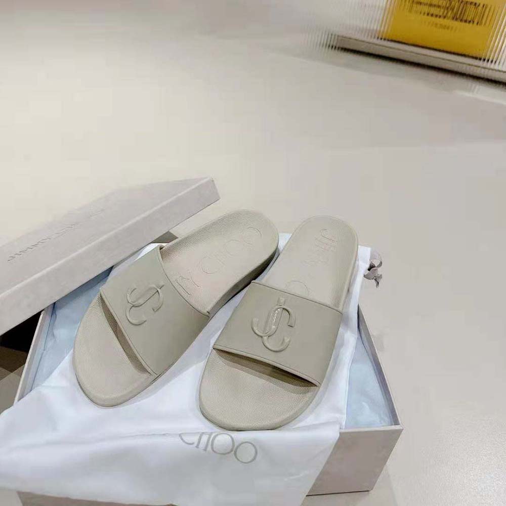 Side view showing sole texture and silhouette of Jimmy Choo slides