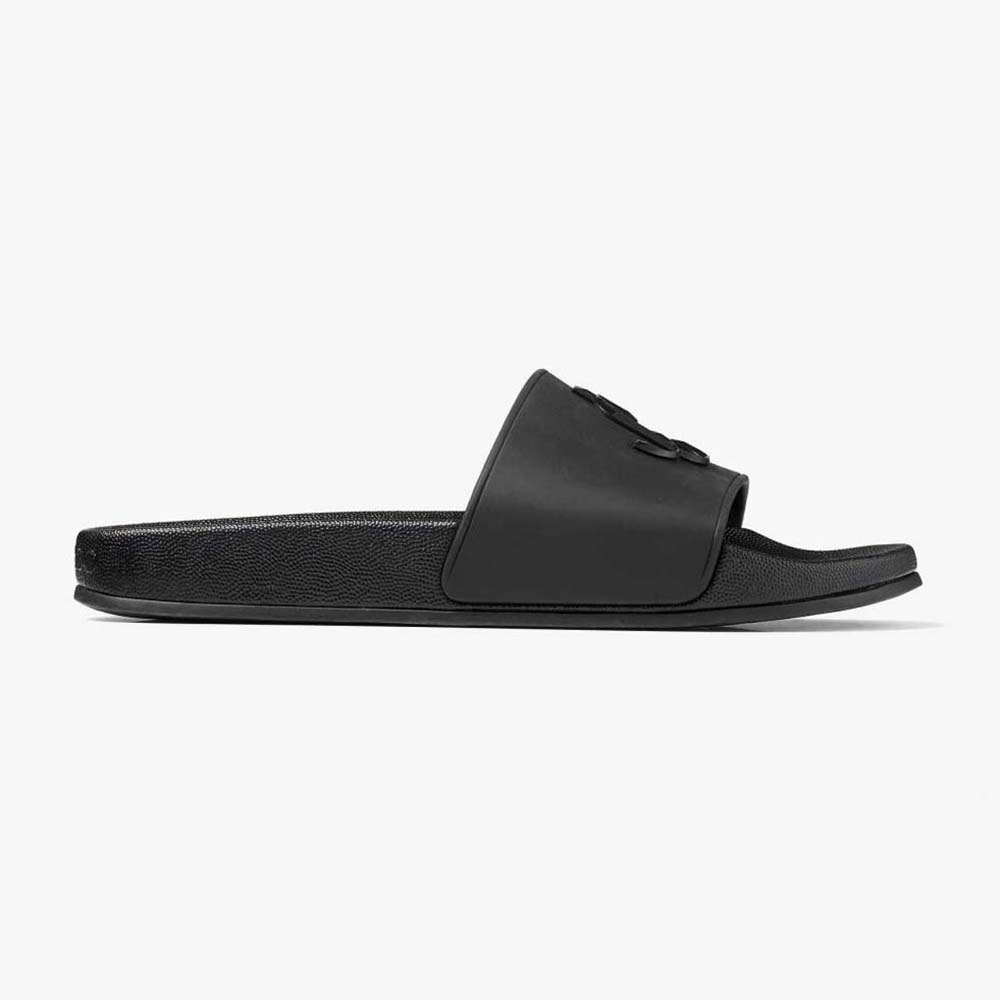Side view of Jimmy Choo Women Port/F Black Rubber Slides with JC monogram