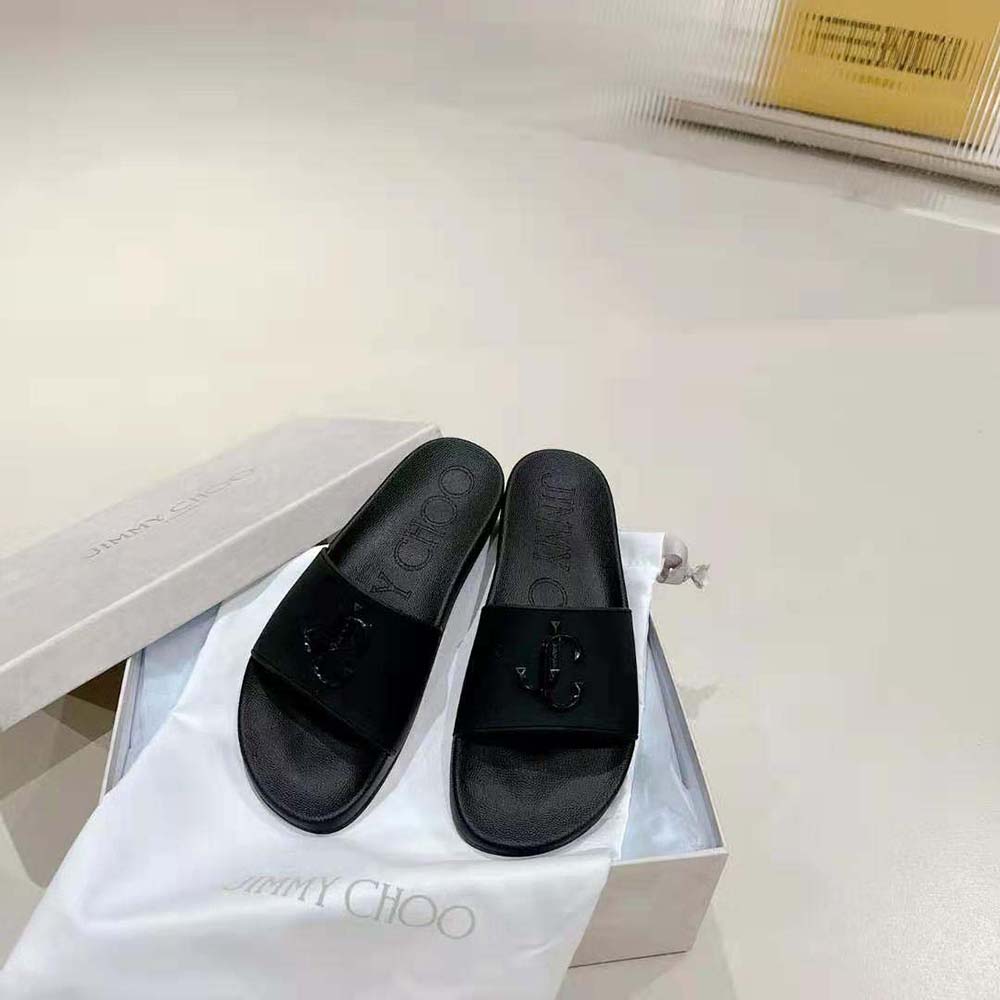 Top-down angle showing black rubber material on Jimmy Choo Port/F slides