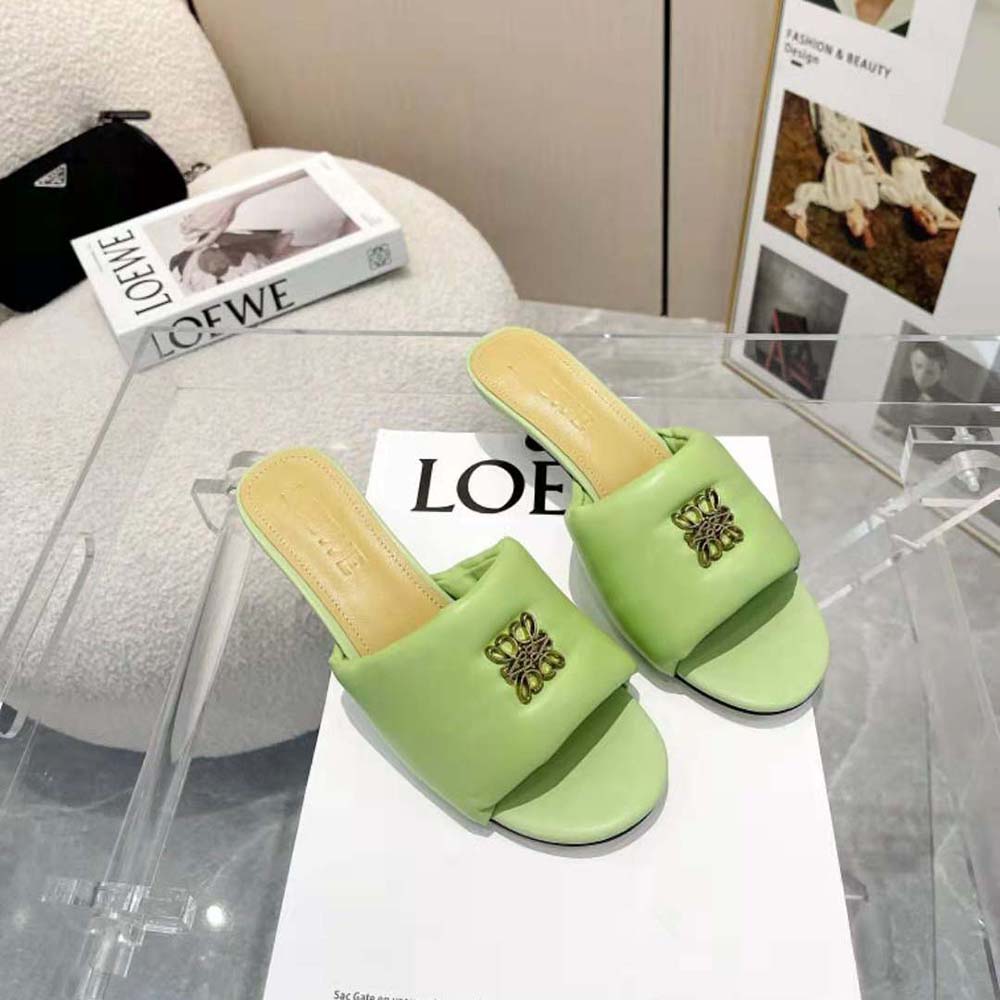Close-up of Loewe Anagram embossed detail on green leather mule