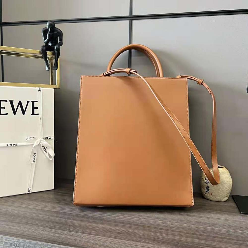 Side angle showing zip closure and structured silhouette of Loewe Standard A4 Tote
