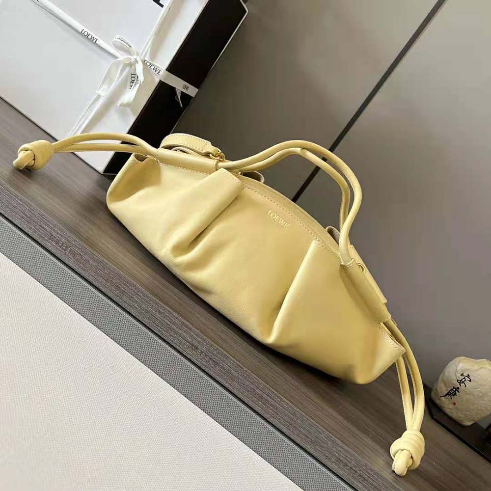Close-up of gold-tone hardware on Loewe Small Paseo Bag flap