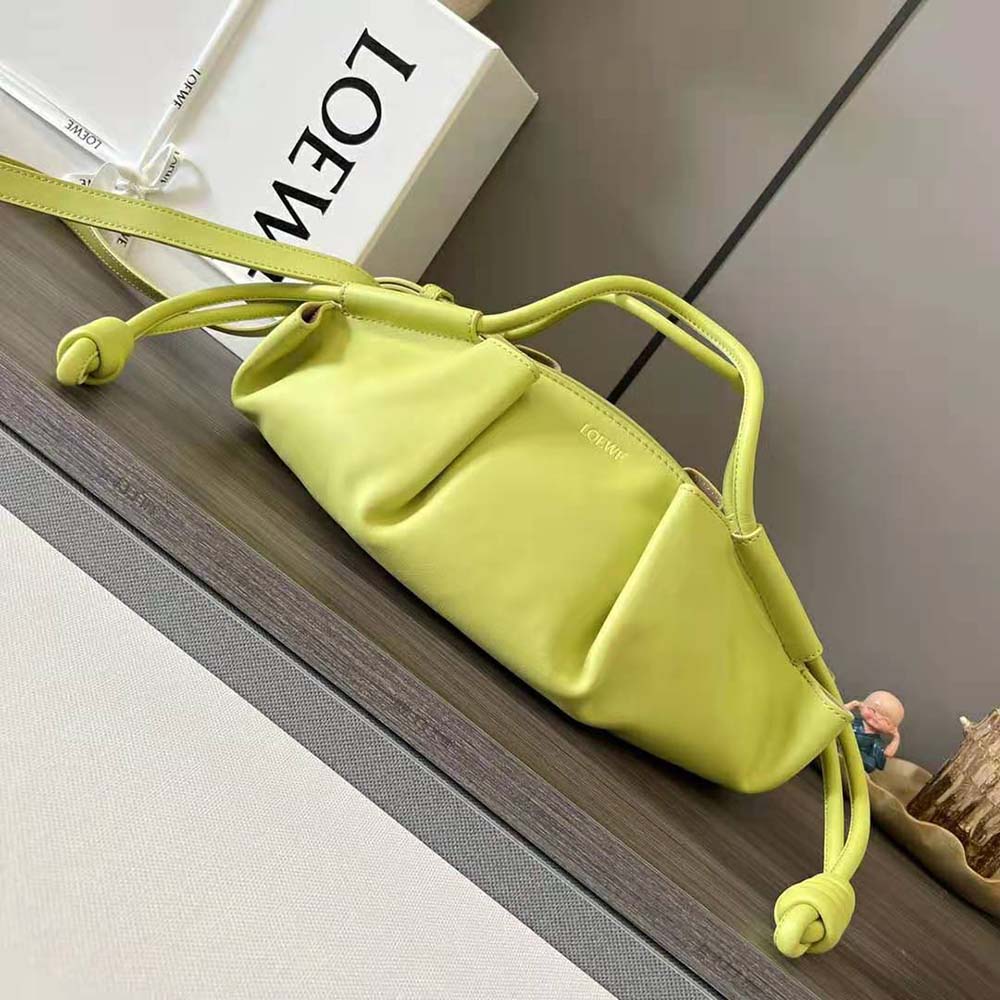 Close-up of gold-tone hardware on yellow Small Paseo Bag by Loewe