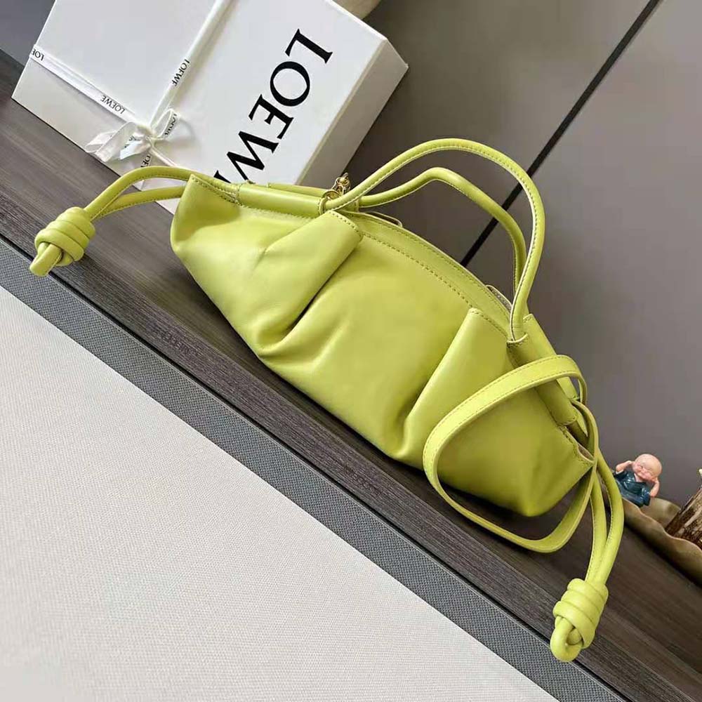 Side profile showing structured silhouette of Loewe Small Paseo Bag in yellow