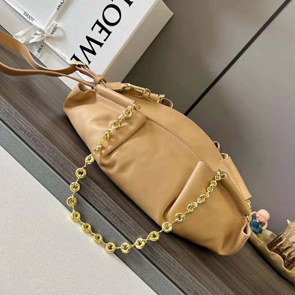 Side angle showing slim silhouette of Loewe Small Paseo Bag Sandy